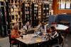 A library with a group of students having a discussion at a table