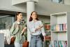 A librarian guides a student