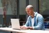 Young man working at laptop