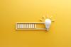 Loading illustration leading to lightbulb on yellow background