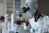 A robot uses a microscope in a laboratory