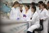 A group of students conducting an experiment in a lab