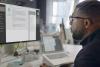 Black man working at computer using AI chatbot