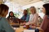 Academics and students talk together