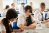 Secondary school pupils studying science in a classroom 