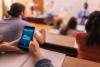 A student opens an AI chatbot in a lecture hall