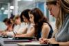 University students working individually at their desks