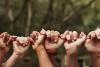 Hands linked in a line