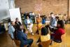 Research participants sit together in a circle