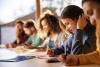 Students concentrate on writing in class