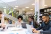 Research staff in a library working on a digital huimanities project