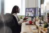 A student on a zoom call in her home office