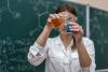 Female teacher doing chemistry demonstration